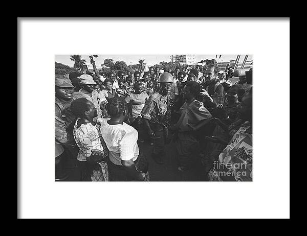 Kampala Framed Print featuring the photograph Soldiers And Citizens Of Uganda Dancing by Bettmann