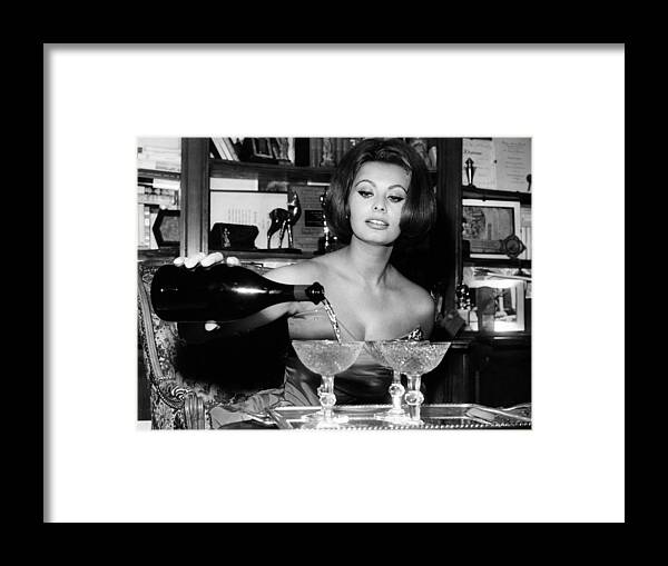 1963 Framed Print featuring the photograph Sophia Loren Pouring Champagne by Globe Photos