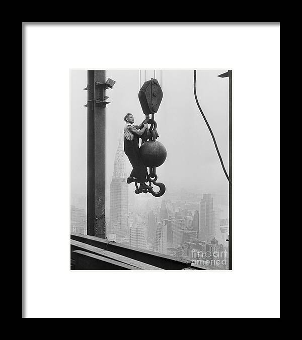People Framed Print featuring the photograph Steel Worker On Structure Rising On Site by Bettmann