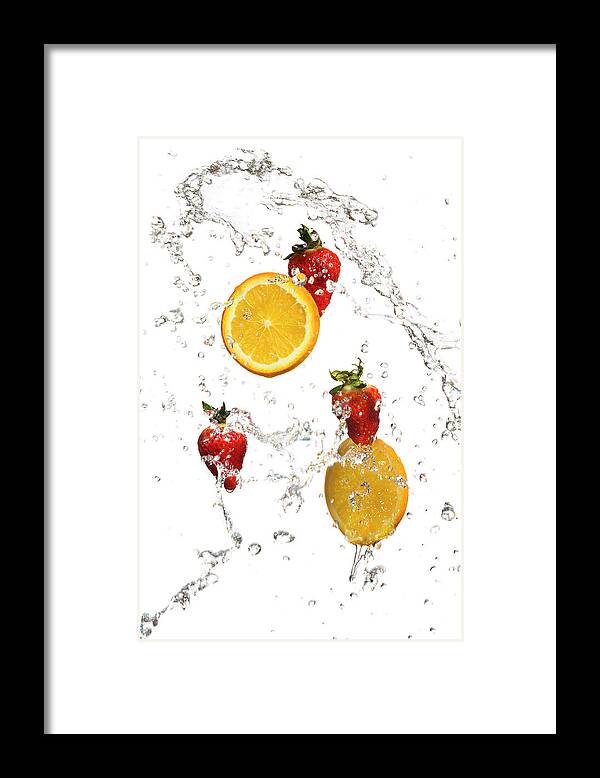 Orange Color Framed Print featuring the photograph Strawberries And Orange Slices In A by Alina555