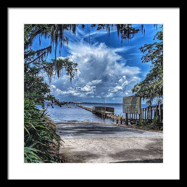 Clouds Framed Print featuring the photograph Strolling by the Dock by Portia Olaughlin