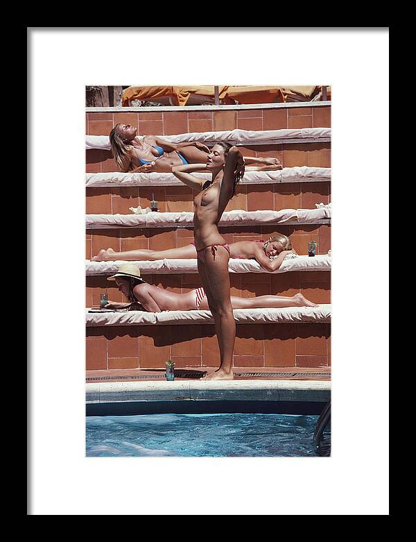 1980-1989 Framed Print featuring the photograph Sunbathing On Capri by Slim Aarons