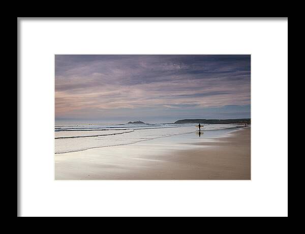 Water's Edge Framed Print featuring the photograph Sunset Surfer Looking Towards The by Lucie Averill