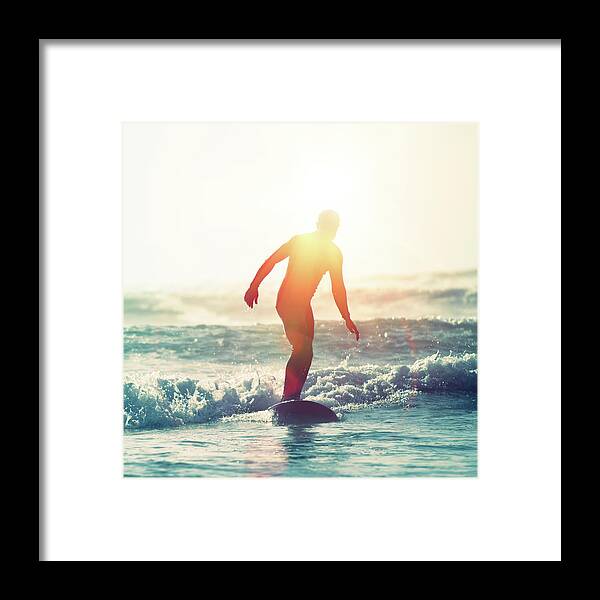 People Framed Print featuring the photograph Surfing Sunflare by Paul Mcgee