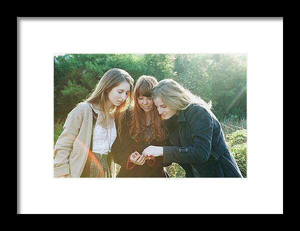 Holding Framed Print featuring the digital art Teenage Girls Admiring Something by Clarissa Leahy