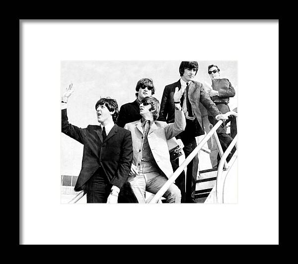 Following Framed Print featuring the photograph The Beatles, L. To R. Paul Mccartney by New York Daily News Archive