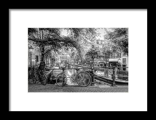 Boats Framed Print featuring the photograph The Black Bike in Amsterdam by Debra and Dave Vanderlaan