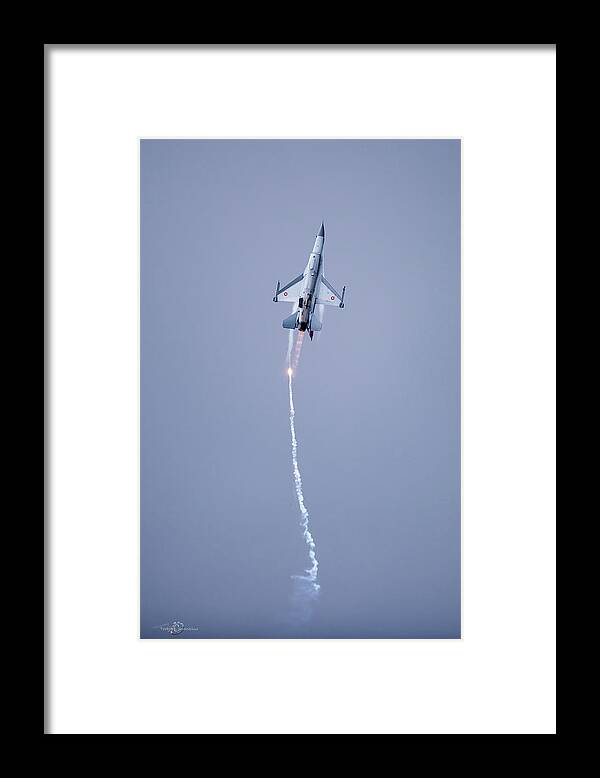 F-16 Fighting Falcon Framed Print featuring the photograph The Danish F-16 Fighting Falcon in high speed action dropping flares by Torbjorn Swenelius