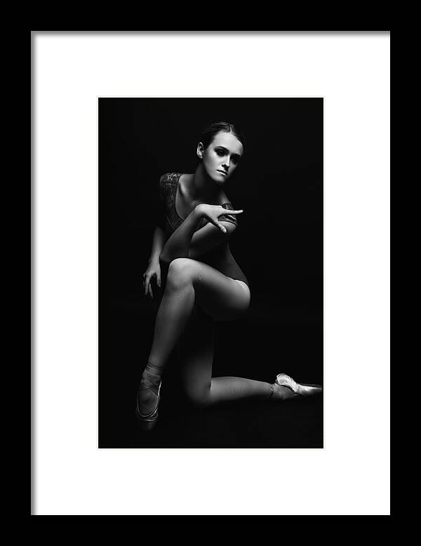 Modern Framed Print featuring the photograph The Touch. The Ballerina, Standing On One Knee And Leaning Forward, Spread Her Arms Up by Alexandr