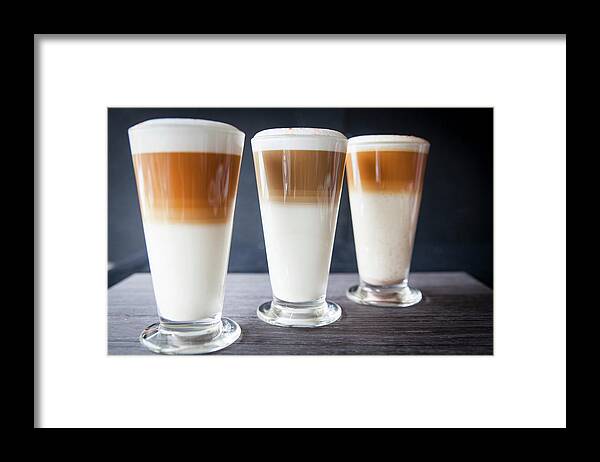 Black Color Framed Print featuring the digital art Three Glasses Of Latte Macchiato On Table by Luka Storm
