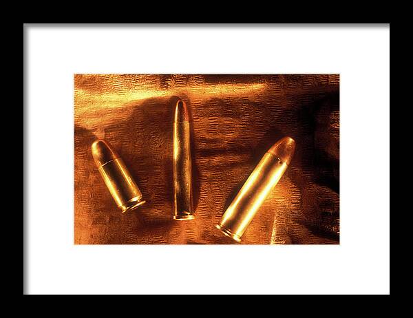 Color Image Framed Print featuring the photograph Three Golden 38 Calibre Bullets by Lyle Leduc