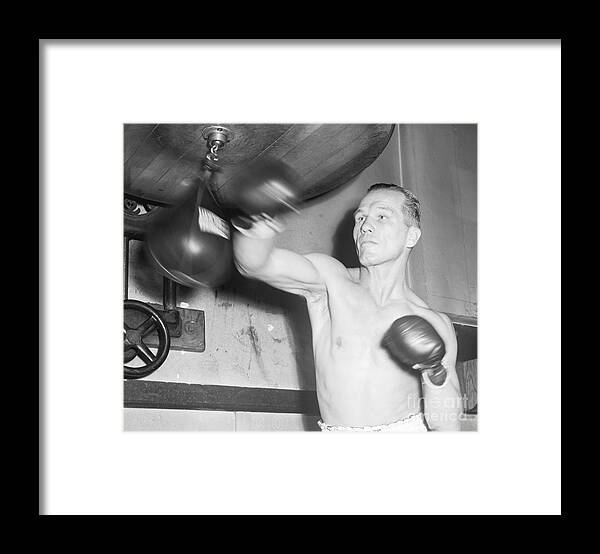 People Framed Print featuring the photograph Tony Zale Punching Small Bag At Gym by Bettmann