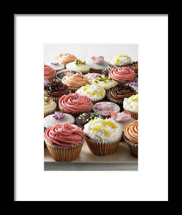 Unhealthy Eating Framed Print featuring the photograph Tray Of Decorative Cupcakes by Diana Miller