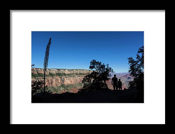 Tranquility Framed Print featuring the photograph Two Silhouetted Hikers Hiking On A by Whit Richardson