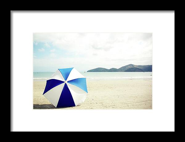 Shadow Framed Print featuring the photograph Umbrella On Sand by Grace Oda