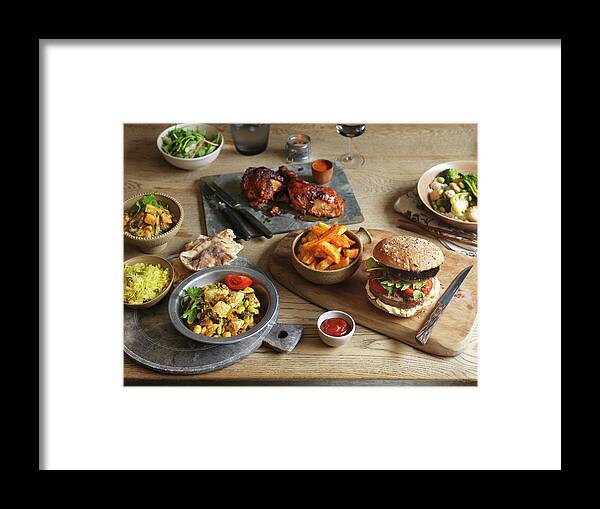 Ip_11318803 Framed Print featuring the photograph Various Dishes And Portobello Hamburger On A Buffet by Jonathan Gregson