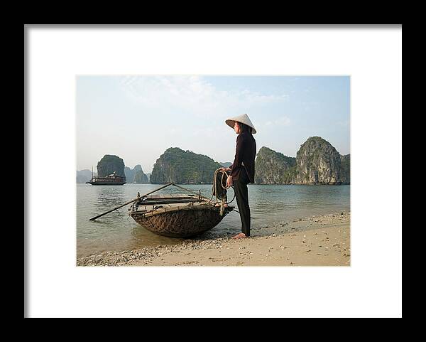 People Framed Print featuring the photograph Vietnam,halong Bay,woman With Boat by Martin Puddy