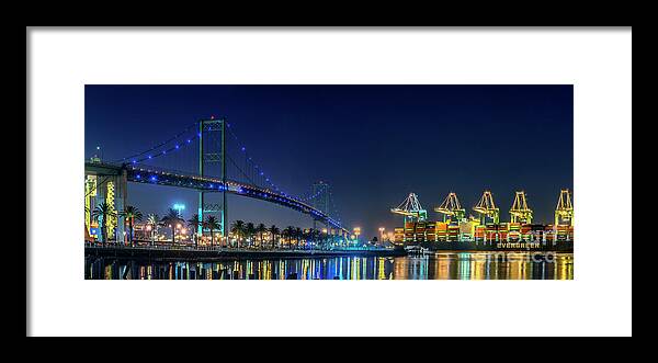 Vincent Thomas Gantry Cranes Lit At Night Framed Print featuring the photograph Vincent Thomas Gantry Cranes Lit at Night by David Zanzinger