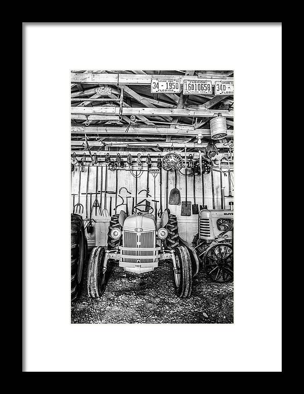 Appalachia Framed Print featuring the photograph Waiting in the Garage Tools and Tractors in Black and White by Debra and Dave Vanderlaan