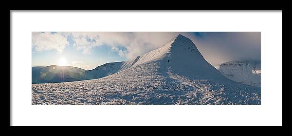 Scenics Framed Print featuring the photograph Wales Winter Snow Mountain Sunburst by Fotovoyager