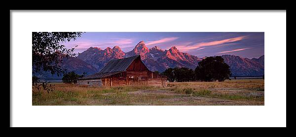 Scenics Framed Print featuring the photograph Weathered Wooden Barn With Mountains by Travelpix Ltd