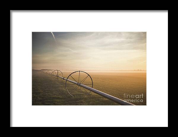 Tranquility Framed Print featuring the photograph Wheels On Field At Sunrise, Long by Chris Amodei