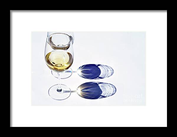 Shadow Framed Print featuring the photograph White Wine Glass With Reflection Shadow by Trinetuzun