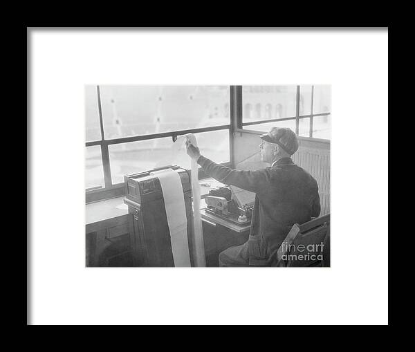 People Framed Print featuring the photograph William Henne Using Teletype Machine by Bettmann