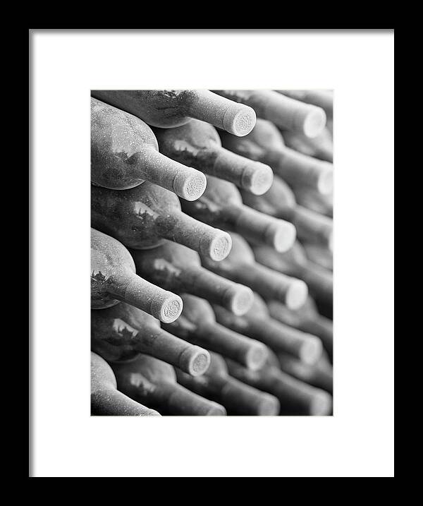 Dust Framed Print featuring the photograph Wine Bottles In Cellar B&w by Terry Vine