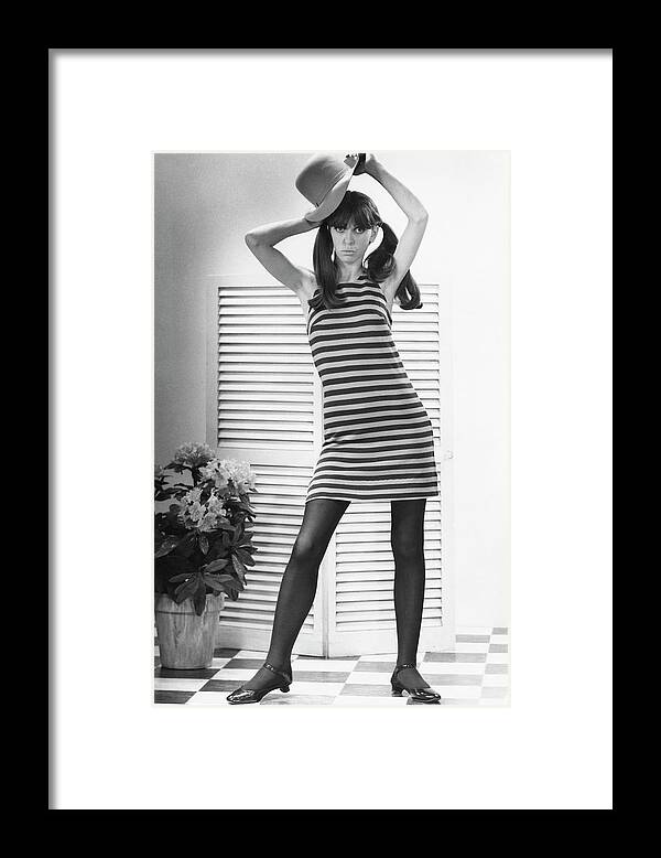 Cool Attitude Framed Print featuring the photograph Woman Modeling Fashion by George Marks