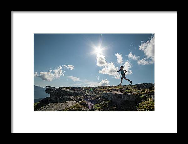People Framed Print featuring the photograph Woman Runs Along Ridge Crest, In by Ascent Xmedia