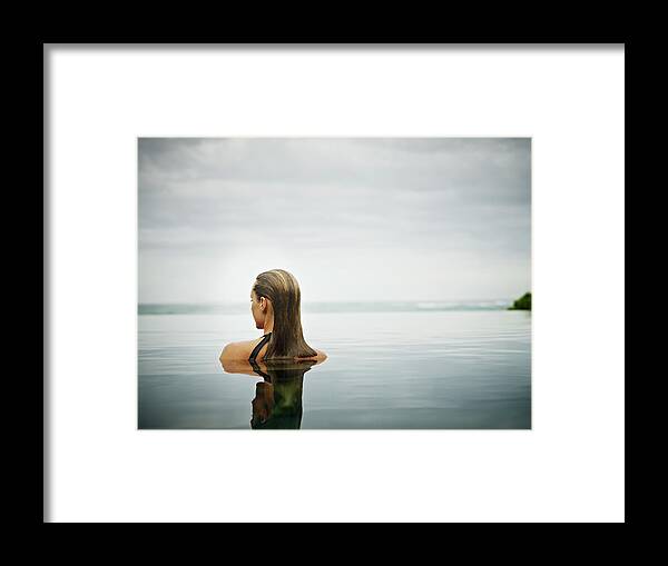 People Framed Print featuring the photograph Woman Standing In Infinity Pool by Thomas Barwick