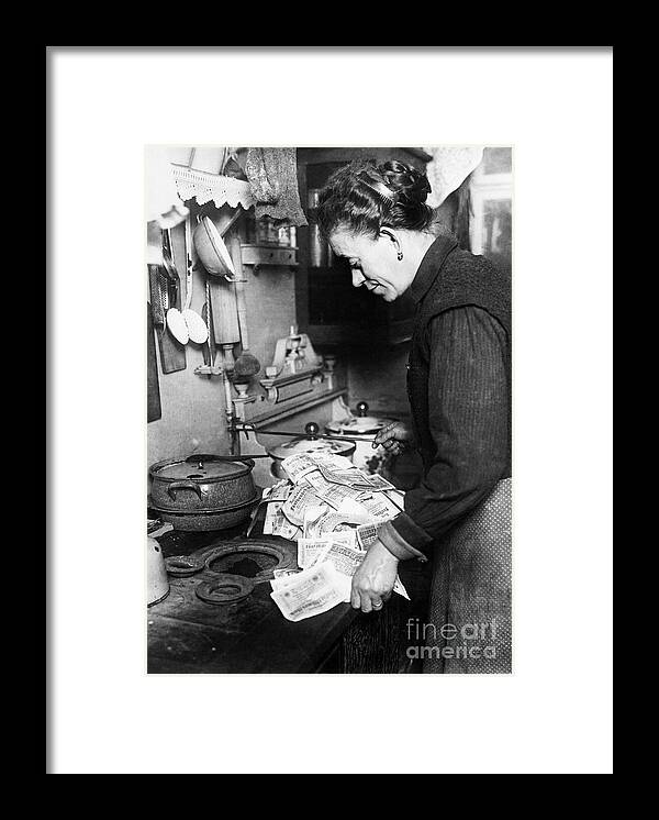 People Framed Print featuring the photograph Woman Using Paper Money To Light Stove by Bettmann