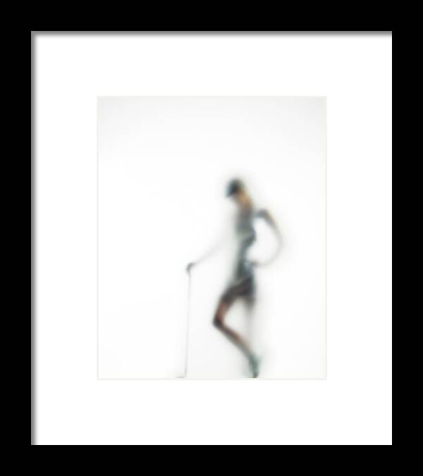 White Background Framed Print featuring the photograph Woman With Golf Club Defocussed by Symphonie
