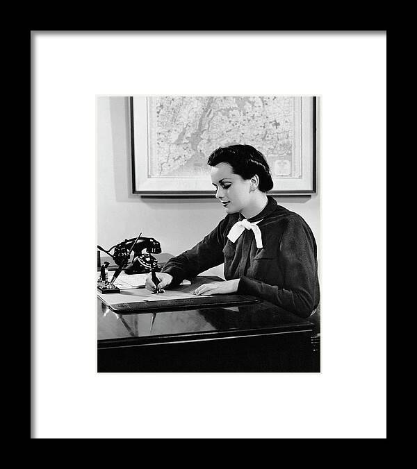 Corporate Business Framed Print featuring the photograph Woman Writing At Desk by George Marks