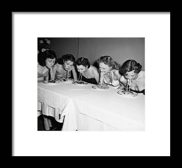 Child Framed Print featuring the photograph Women In A Spaghetti Eating Contest by Bettmann