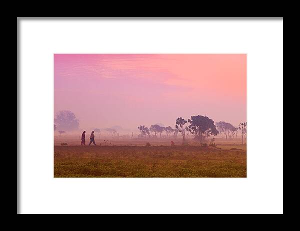 Scenics Framed Print featuring the photograph Women Villagers Crossing Field At Dawn by Adrian Pope
