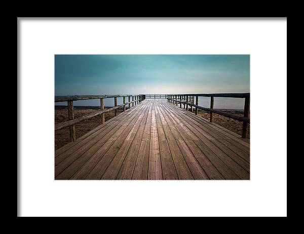 Tranquility Framed Print featuring the photograph Wooden Pier by Christian Callejas