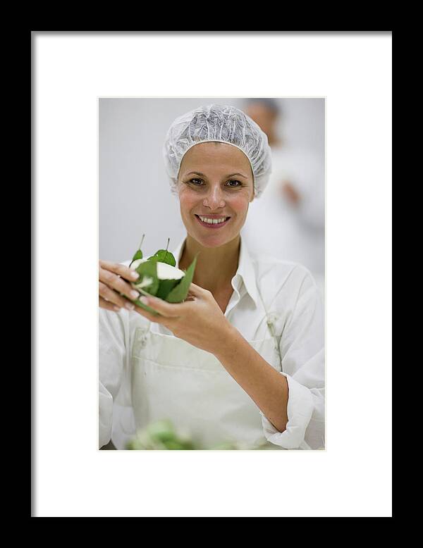 Holding Framed Print featuring the digital art Worker At A Cheese Dairy by Zero Creatives