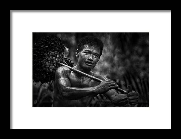 Malaysia Framed Print featuring the photograph Worker by Peter Davidson