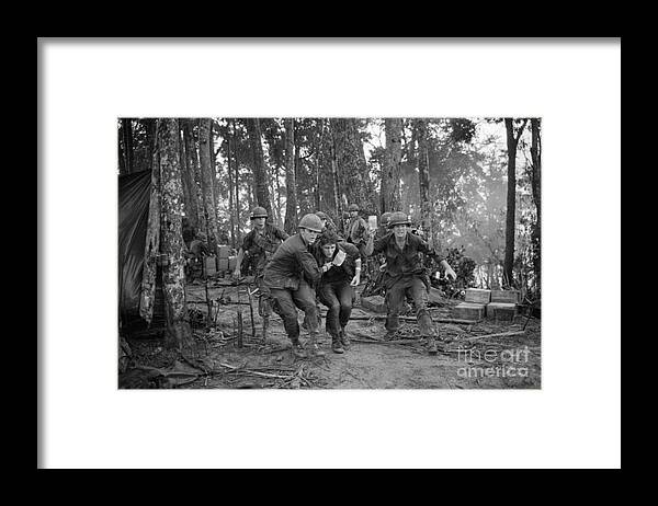 Vietnam War Framed Print featuring the photograph Wounded Soldier Taken To Helicopter by Bettmann
