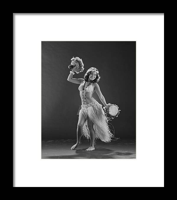 People Framed Print featuring the photograph Young Woman Hula Dancer With Feathered by Tom Kelley Archive