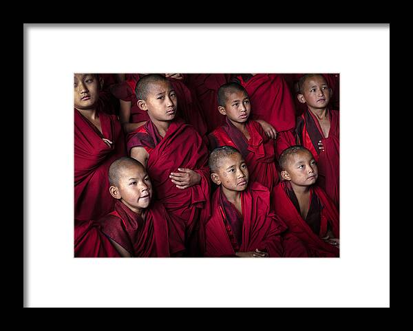 Bhutan Framed Print featuring the photograph Youthful Serenity: Young Monks At Chorten Ningpo Monastery, Bhutan by Rudy Mareel