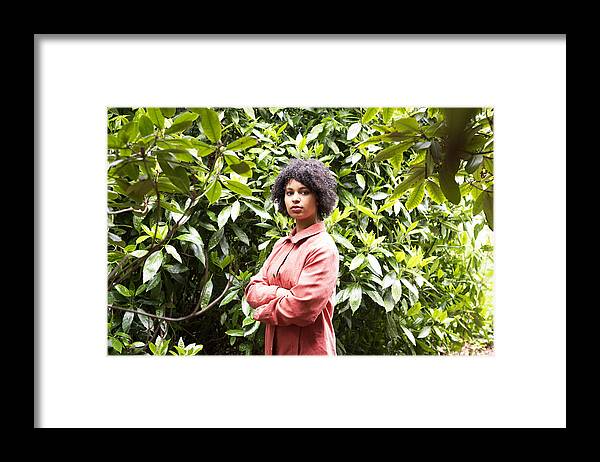 Netherlands Framed Print featuring the photograph A young woman in a park. by Roos Koole