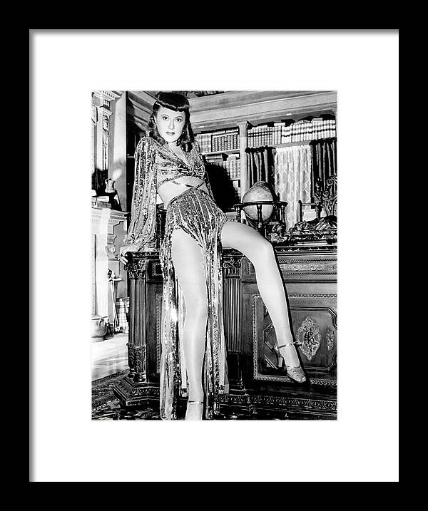 Barbara Stanwyck Framed Print featuring the photograph BARBARA STANWYCK in BALL OF FIRE -1941-, directed by HOWARD HAWKS. #1 by Album
