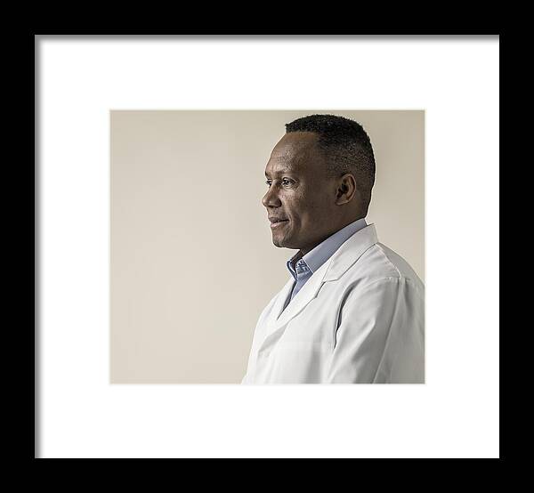 Expertise Framed Print featuring the photograph Black male in laboratory coat #1 by Colin Hawkins