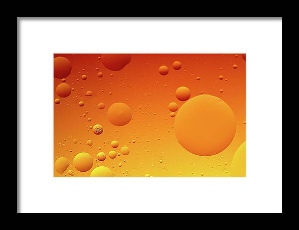 Connection Framed Print featuring the photograph Bright abstract, yellow background with flying bubbles by Michalakis Ppalis