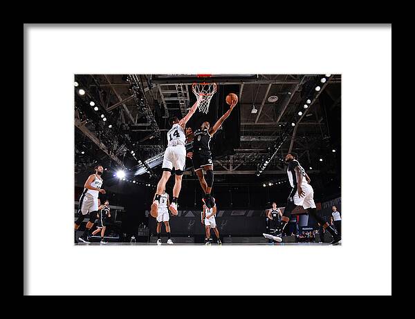 Nba Pro Basketball Framed Print featuring the photograph Brooklyn Nets v San Antonio Spurs by Jesse D. Garrabrant