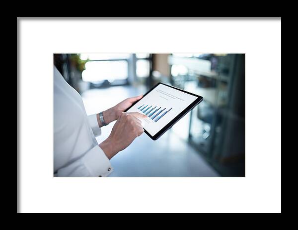 Financial Figures Framed Print featuring the photograph Business Report On Digital Tablet by Dowell