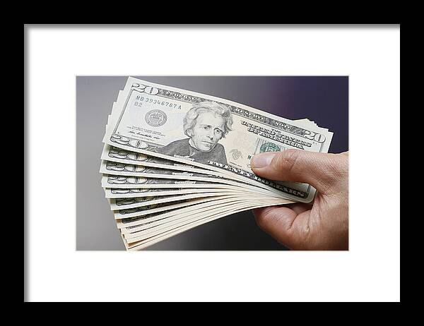 Working Framed Print featuring the photograph Businessman Holding US Dollars #1 by Thomas Trutschel